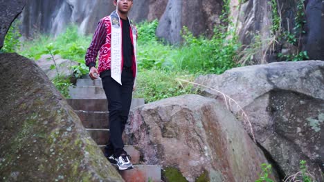 Young-people-walk-and-enjoy-the-beauty-of-nature-on-the-stairs-or-large-rock-cliffs-in-the-city-of-Cirebon
