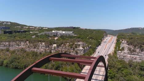 Moving-backwards-reveal-drone-shot-of-the-Pennyback-360-bridge-in-Austin,-Texas