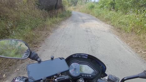 motorcycle-rider-ridding-bike-in-forests-trails-at-day-from-flat-angle