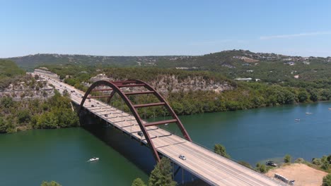 fly-over-drone-shot-of-the-Pennybacker-bridge-in-Austin,-Texas