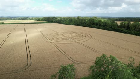 Aerial-view-flying-over-idyllic-Hampshire-countryside-towards-South-Wonston-2023-crop-circle-pattern
