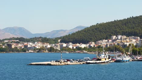 Greece,-view-of-the-port-in-the-city-of-Igoumenitsa,-with-mountains-and-the-town-in-the-background
