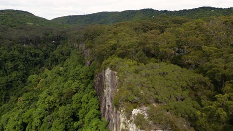 Right-to-left-Aerial-over-Twin-Falls-walking-area,-Springbrook-National-Park,-Gold-Coast-Hinterland,-Queensland,-Australia