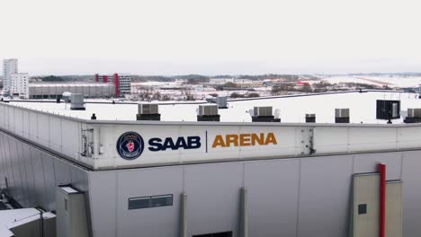 Dynamic-aerial-reveal-of-Saab-Arena-and-city-Linköping-in-background