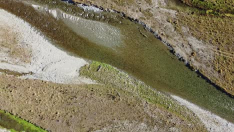 Aerial-view-of-clear-braid-river-with-slow-rotation