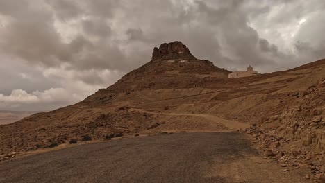 Driving-to-Ksar-Guermessa-troglodyte-village-in-Tunisia-on-cloudy-day