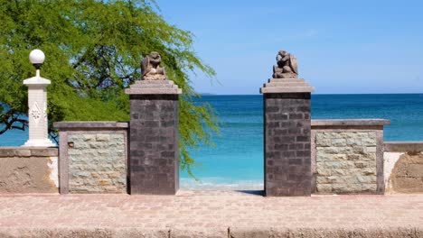 Scenic-view-of-turquoise-ocean-and-stone-turtle-statues-in-capital-city-Dili,-Timor-Leste,-Southeast-Asia