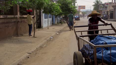 Man-pushing-a-cart-in-Ounaminthe-in-Haiti