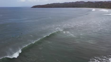 Aerial-drone-shot-of-surfers-at-sea-in-Panama