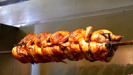 Golden-chicken-roasts-on-a-rotisserie