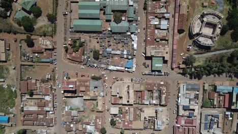 Buildings-and-streets-urban-landscape-of-African-town-in-Kenya,-aerial-top-down