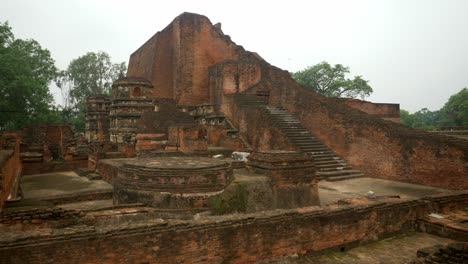 A-close-look-of-the-main-temple-ruins-on-the-site-of-Nalanda-Mahavihara-the-oldest-Buddhist-monastic-university-that-was-demolished-by-Mughal-Invaders,-overcast-cloudy