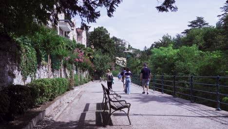 People-enjoying-a-walk-on-a-nice-summer's-day-along-the-Passer-Promenade-in-the-heart-of-Meran