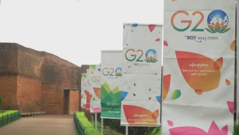Close-up-of-the-banners-of-the-G20-nation-India-Summit-2023-put-up-at-the-tourist-site-of-Nalanda-Mahavihara-ruins-in-Bihar-for-foreign-delegates