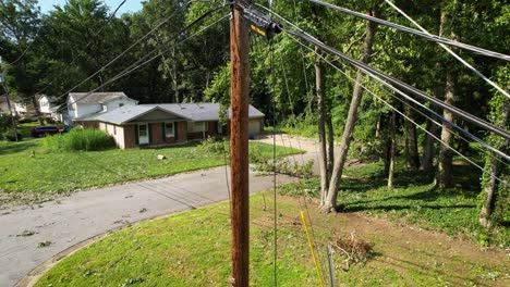 damaged-utility-pole-power-lines-drone-slow-rise