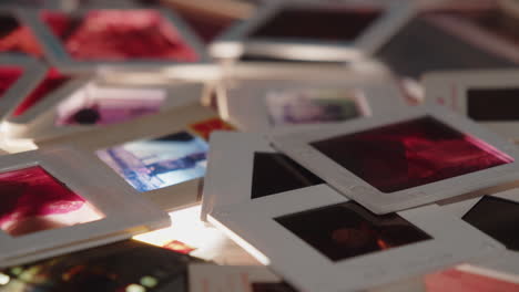 Photographic-slides-in-plastic-frames-thrown-on-a-light-table
