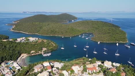 Syvota-Coastal-Village,-Boats-and-Islands-in-Ionian-Sea,-Epirus,-Greece-Mainland---Aerial