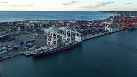 Aerial-View-of-Container-Ship,-Cranes-and-Containers-in-the-Port-of-Fremantle-in-Perth-Australia