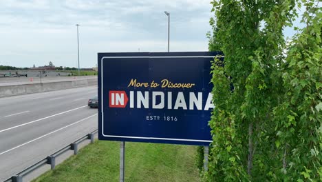 More-to-Discover-in-Indiana-state-border-road-sign