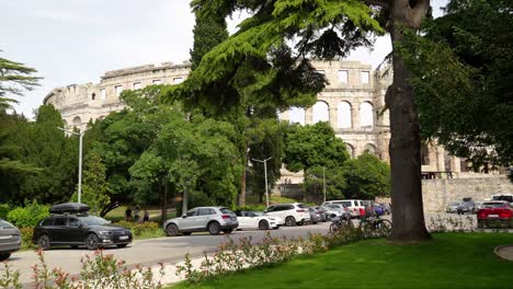 Vehicles-parked-outside-the-Amphitheater-in-Pula,-Northwestern-Croatia