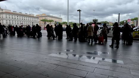 Silhouette-Queue-Of-People-Lining-Up-At-Piazza-dei-Cinquecento-To-Get-Taxi-At-Rome-Termini-Station