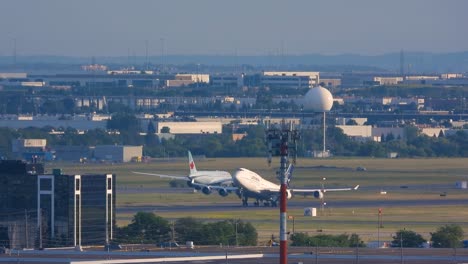 tracking-shot-of-a-white-commercial-fly-plane-taking-off-of-the-Toronto-Pearson-International-Airport