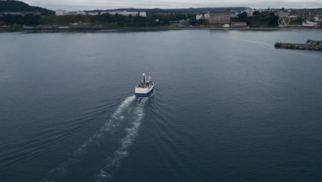 Drone-Shot-of-Fishing-Boat-Entering-Scarborough-Harbour