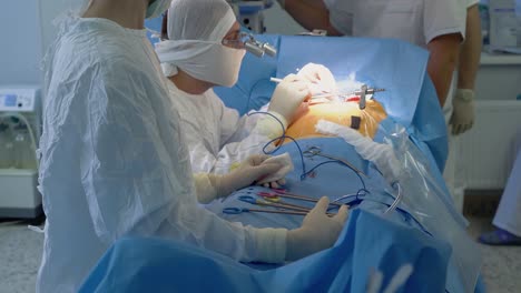 Cardiosurgeon-performs-heart-surgery-with-the-assistance-of-nurse
