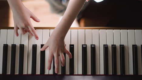Girl-pianist-practices-performing-composition-with-staccato
