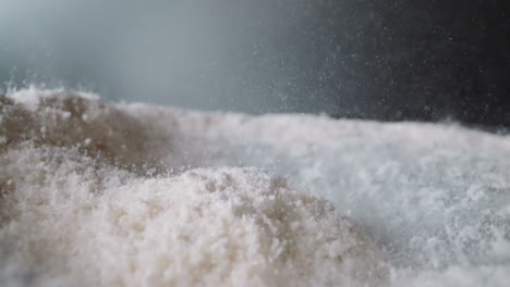 Powdered-sugar-bounces-on-surfaces-from-vibration-of-table