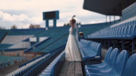 Young-beautiful-bride-defocused-stands-in-the-stadium