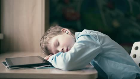 Slow-motion-child-fell-asleep-while-he-was-doing-his-homework