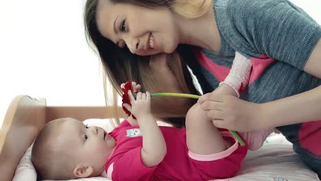Young-mother-playing-with-her-baby-4