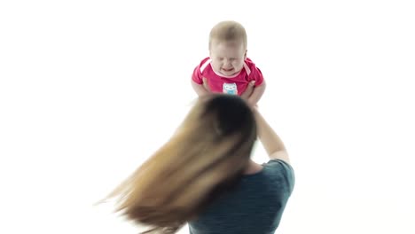 mother-plays-with-her-child-throws-him
