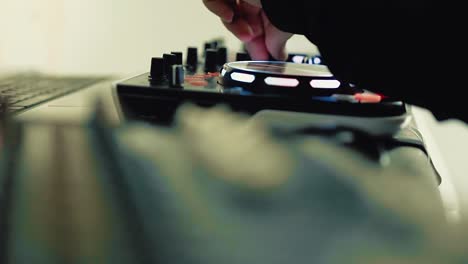 DJ-works-on-DJ-console