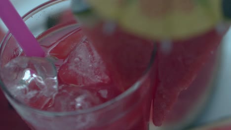 macro-ice-cubes-in-drink-with-triangle-watermelon-slice