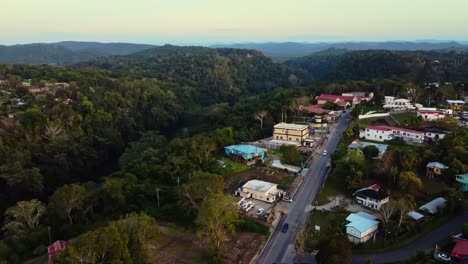 Aerial-over-the-colourful-town-of-San-Ignacio-to-the-lush-mountains-behind-in-Belize