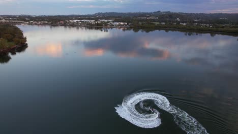 Aerial-View-Of-Jetskier,-Jetskiing-In-The-Maroochy-River-In-QLD,-Australia