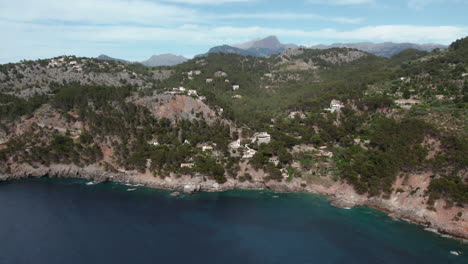 Breathtaking-View-Of-Port-de-Soller-Village-On-Rocky-Mountains-Near-Deià-In-Mallorca,-Spain