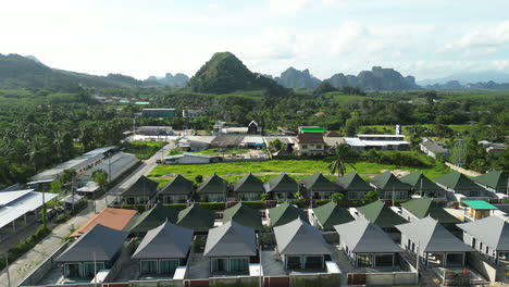 Newly-built-real-estate-houses-in-Krabi-surrounded-by-nature,-Thailand,-Drone-shot