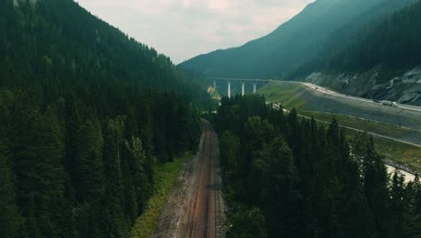 Aerial-rising-view-of-Canadian-Pacific-Railway,-spectacular-wilderness