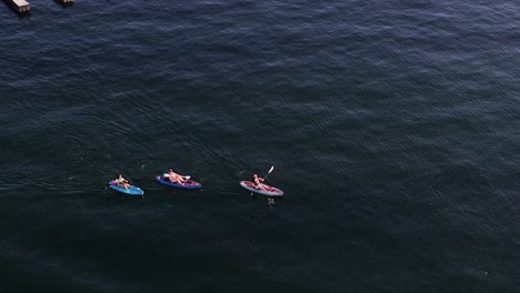 kayakers-on-lake-arrowhead-in-california-enjoying-a-sunny-day-AERIAL-ORBIT