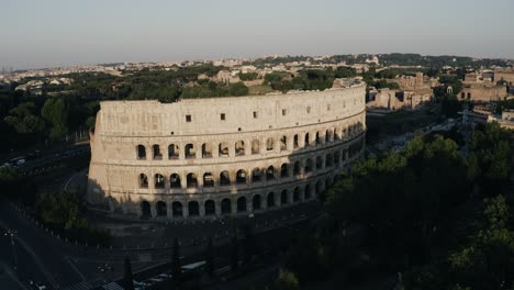 Aerial-view-pulling-away-from-the-Roman-Colosseum-with-a-bird-flying-by