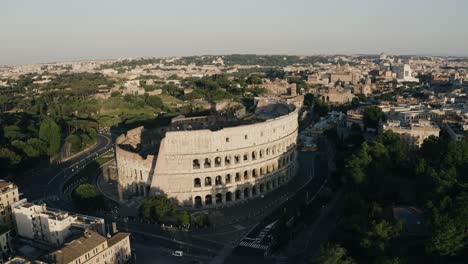 Aerial-view-pushing-towards-the-Rome-Colosseum-near-sunset