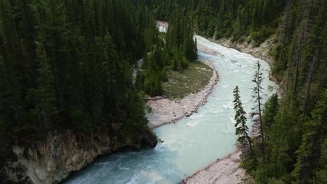 Drone-shot-following-the-winding-Blaeberry-river,-sunny-day-in-BC,-Canada