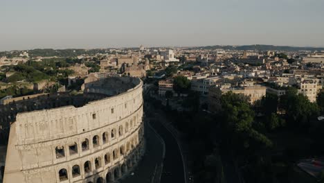 Aerial-view-pulling-away-from-Rome's-Colosseum-at-sunrise