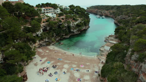 Aerial-View-of-Tourists-In-Playa-de-Cala-Pi-in-Mallorca,-Spain
