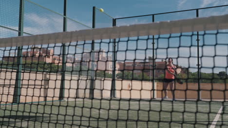 Padel-tennis-player-does-a-drive-shot