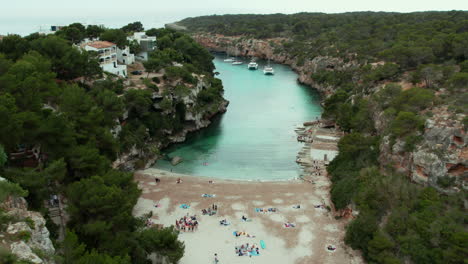 Tourists-At-The-Paradise-Beach-Of-Playa-Cala-Pi-Nature-Reserve-In-Mallorca,-Spain