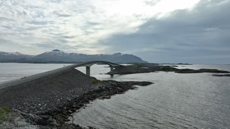 Atlantic-road-aerial---Famous-Norwegian-road-seen-during-quiet-and-partly-cloudy-springtime-afternoon---Slowly-moving-backwards-close-to-Storseisundet-bridge